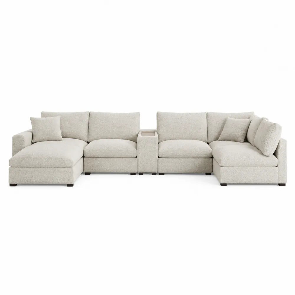 Sofá seccional de tela beige con chaise longue y mesa central