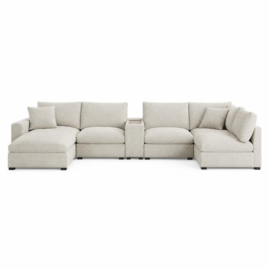 Sofá seccional de tela beige con chaise longue y mesa central
